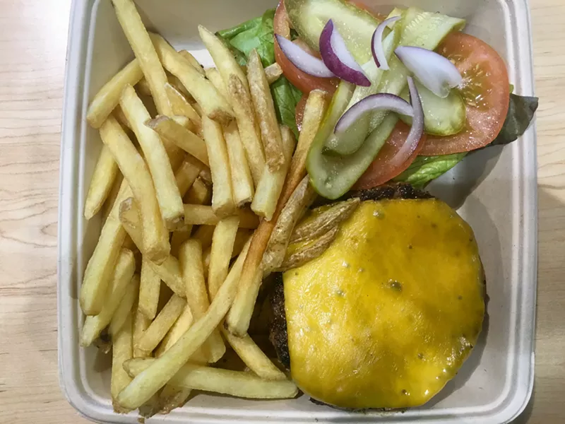 Image: A simple grilled cheeseburger with cheddar for $9.99 at Central Market. No mustard or mayo.