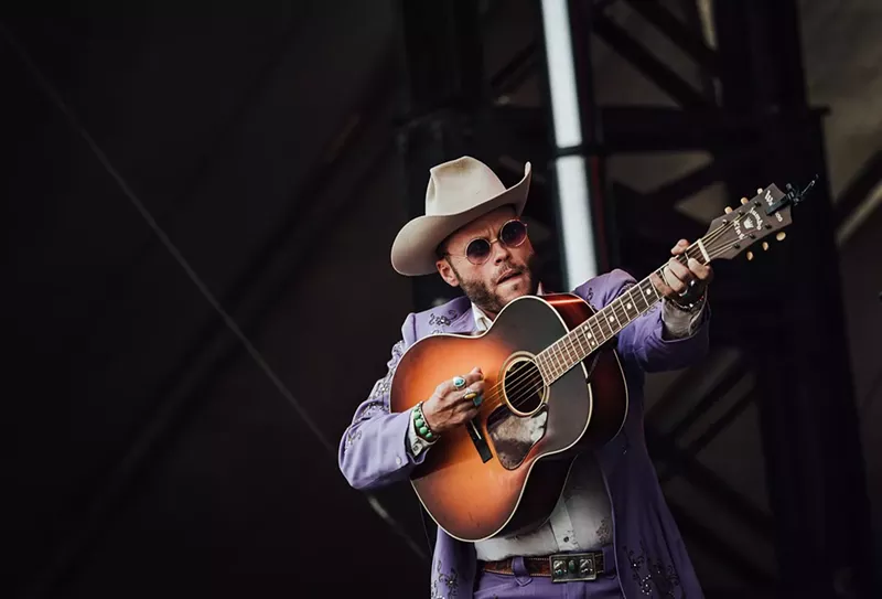 Image: Photo of man playing guitar