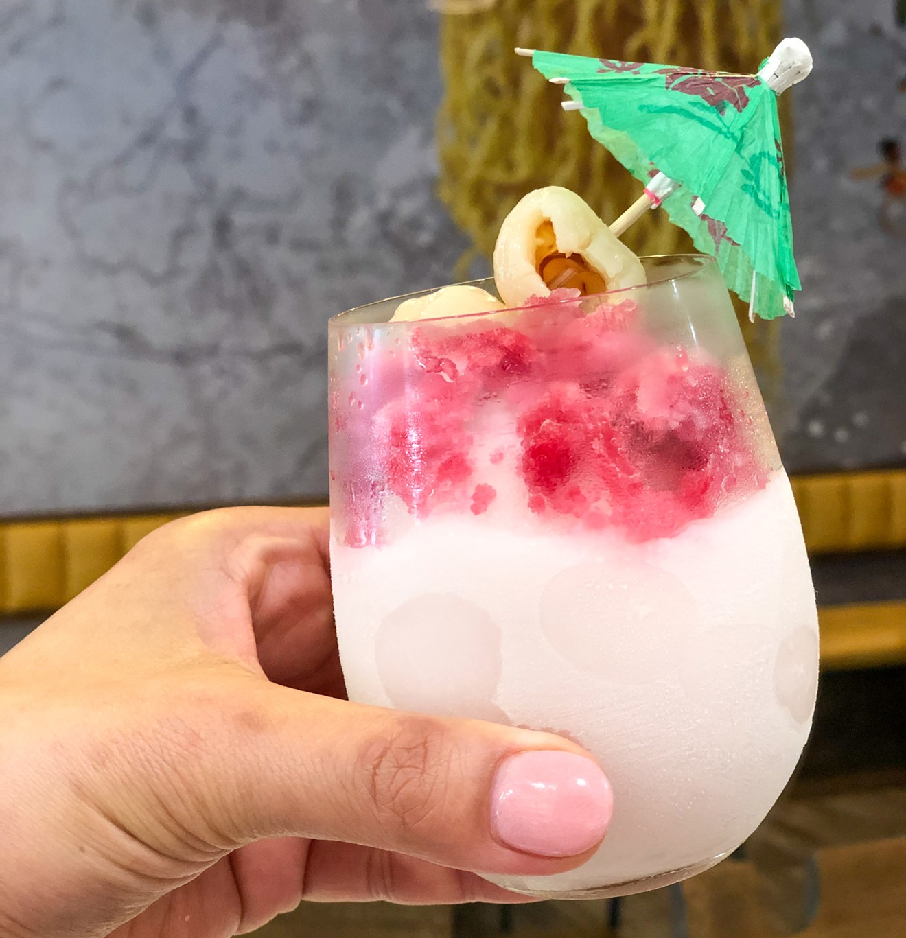 The Pinkies Up cocktail is just the lychee-hibiscus-peach drink we need today.