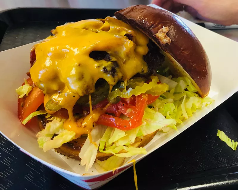 Image: A Kenny Mills burger almost makes us envy Arlington.