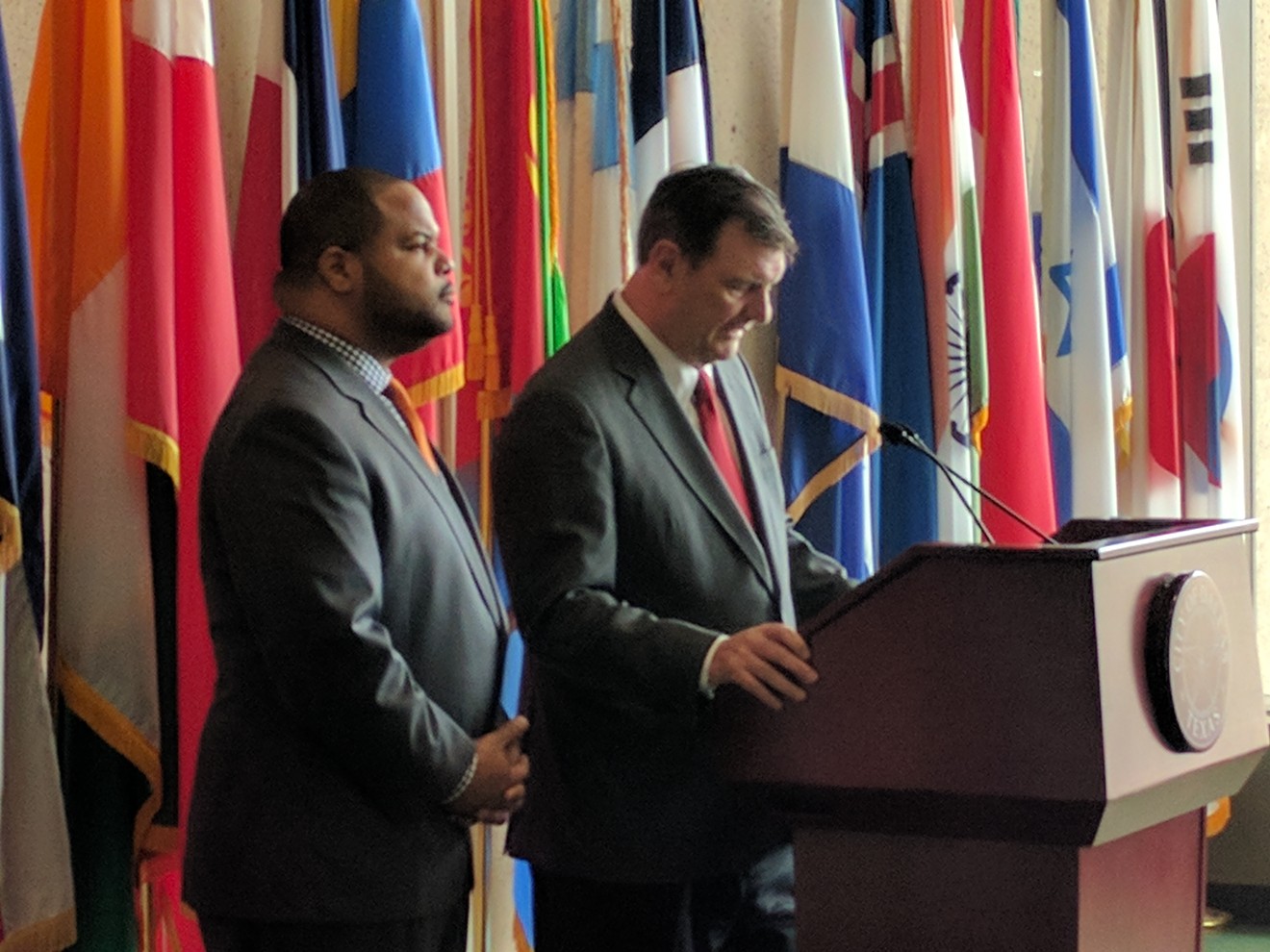 Eric Johnson (left) and Mike Rawlings at Dallas City Hall decrying potential voter fraud in April.