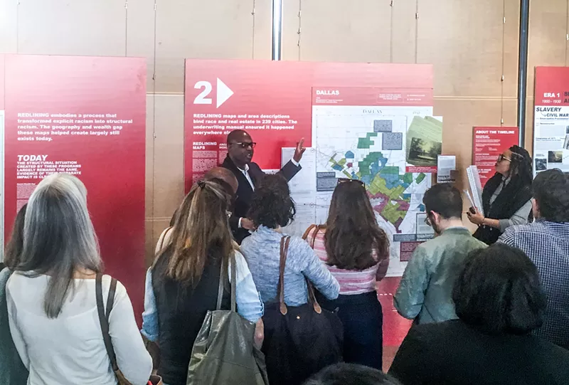 Image: Victor Obaseki, Dallas' first equity officer, gives a tour of the Undesign the Redline exhibit.
