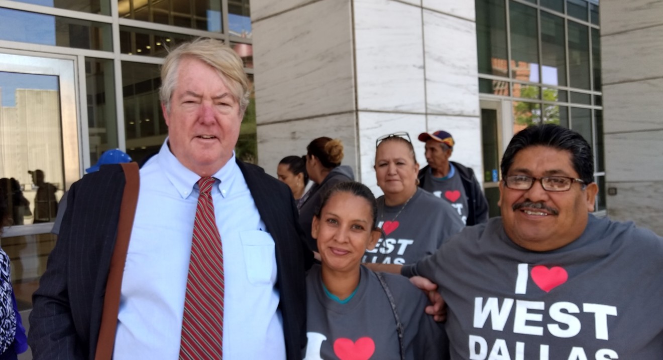 John Carney and clients in front of the George L. Allen Sr. Courts Building.