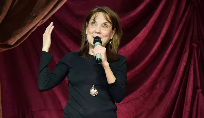 Image: Comedian and Back Door Comedy Club co-founder Linda Stogner performs in her first feature-length special Welcome to My Planet filmed by Dry Bar Comedy.