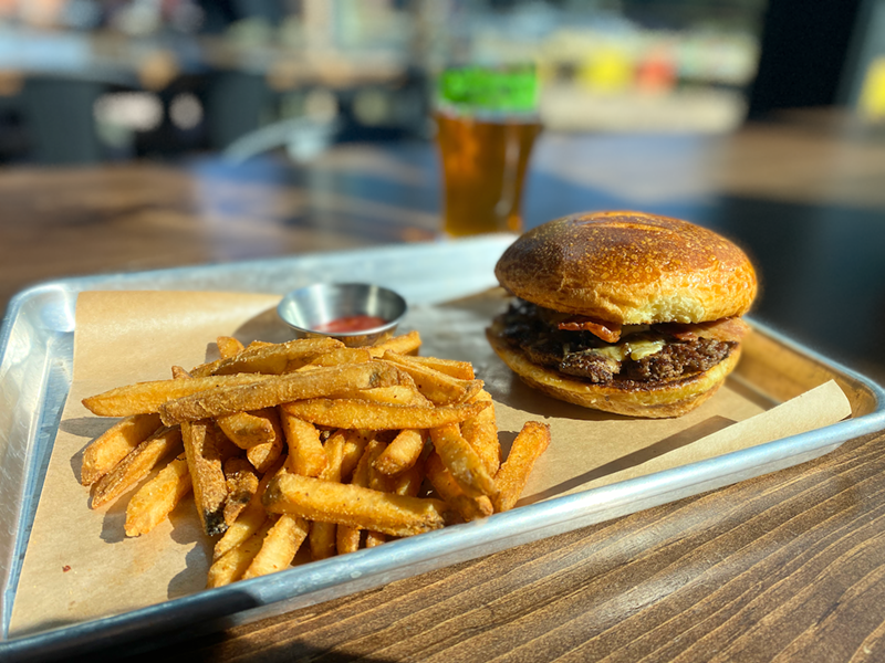 Image: The Standard Burger is $14 for a single and comes with haus fries.