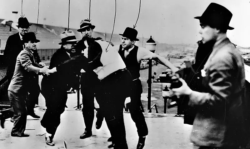 Image: The Battle of the Rouge Overpass, May 26, 1937. The goons doing the assault and beating were thugs employed by Harry Bennett, Henry Ford's right-hand man. The people being beaten were organizers for the United Auto Workers.