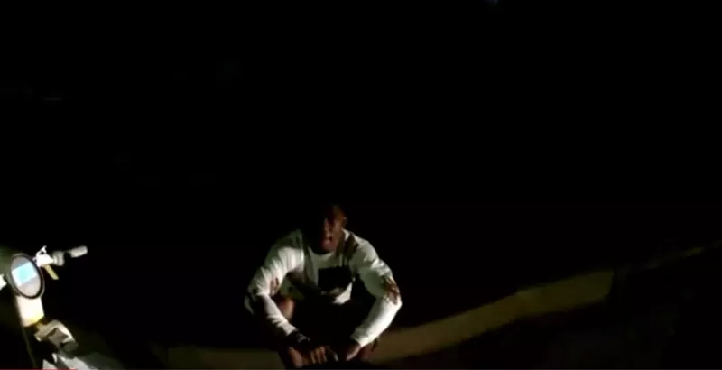 Image: Terrance Williams sat on the curb after falling off his electric bike.