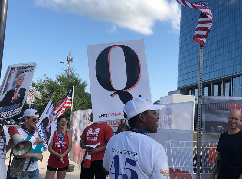 QAnon acolytes gather outside the Omni Dallas Hotel for Q Con over Memorial Day Weekend.