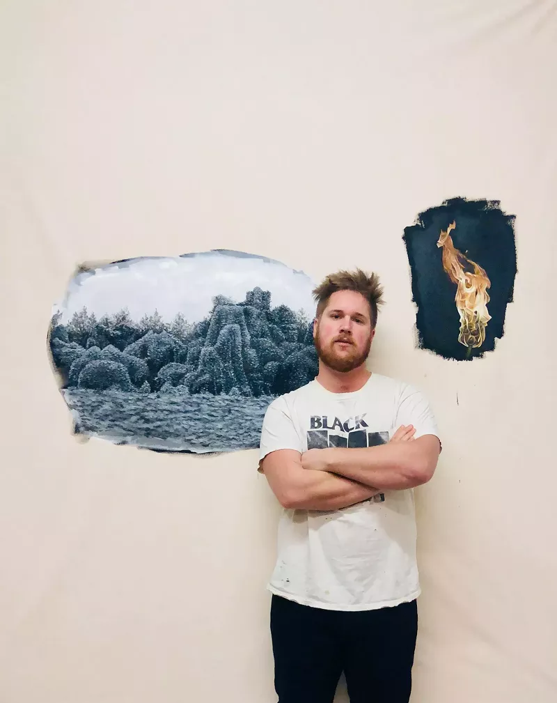Image: William Binnie stands with "The Vine that Ate the South," still in progress. The painting will be part of an exhibit at the Massachusetts Museum of Contemporary Art that opens in March.