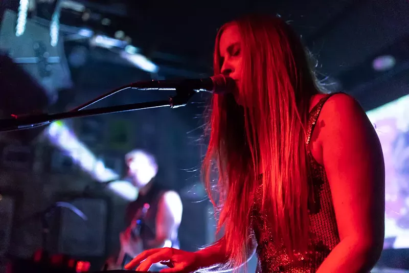 Image: Secrecies playing at their album release party July 12 at Three Links in Deep Ellum, where they debuted visual components to every track on their album.