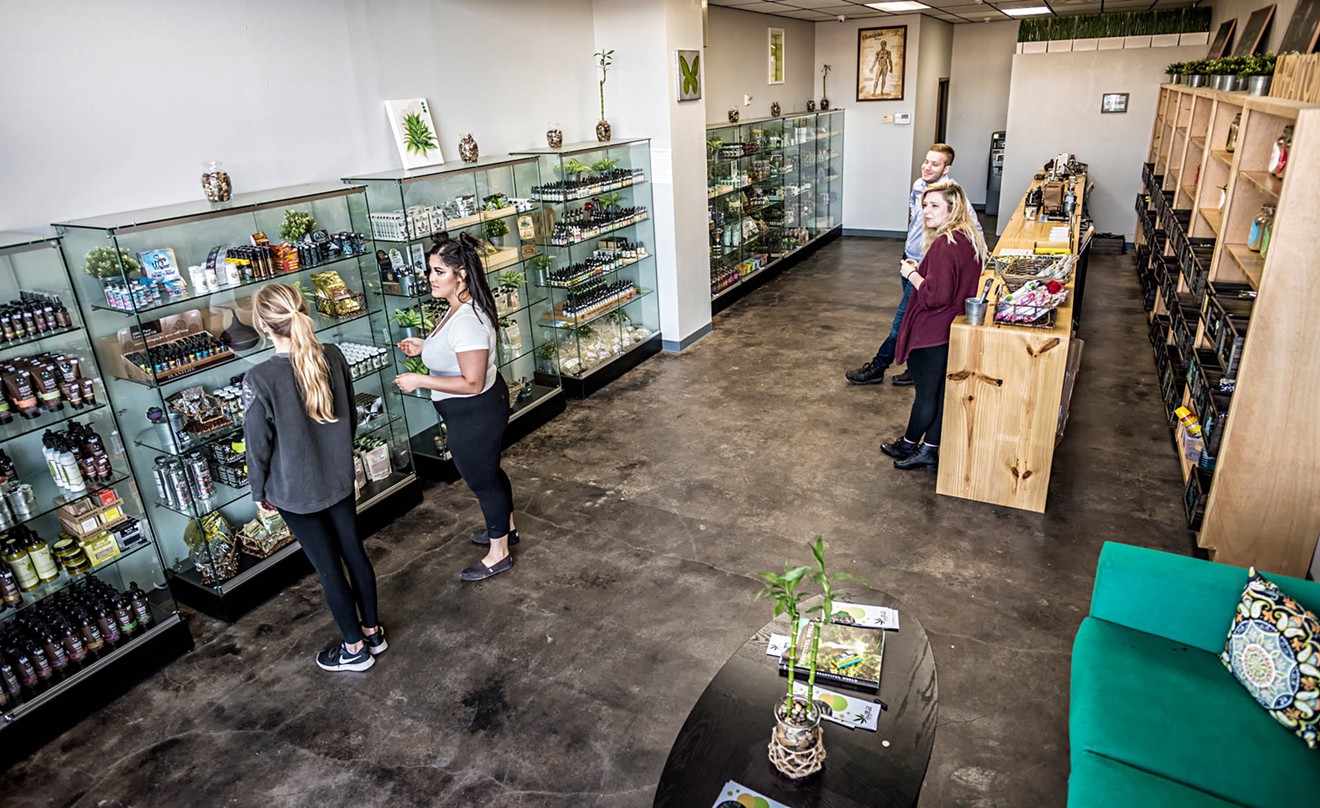 Customers browse kratom products at the CBD Kratom store in Knox Henderson.