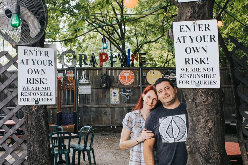 Image: Grapevine owners Michelle Honea and her husband, Ronny, in the patio area of the bar.