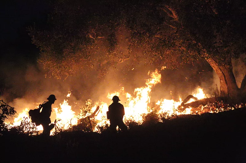 Image: A fire broke out in a large field between two apartment complexes in southern Dallas. Dallas Fire-Rescue needed help putting it out.