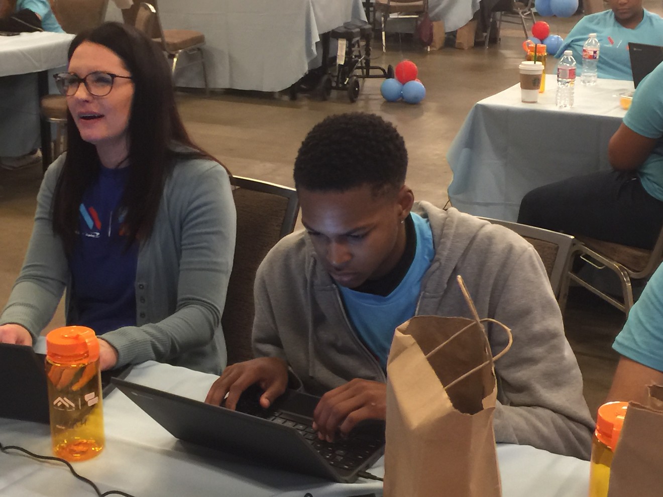North Dallas High School junior Kevontae Harris works on the code for an artificial intelligence program during a Guinness world record attempt for the largest AI programming lesson on Wednesday at the Hilton Anatole.