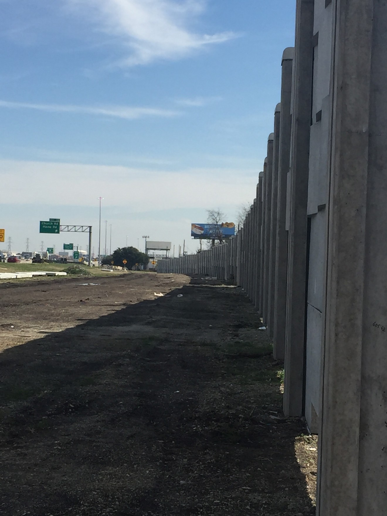 Dallas' great wall is actually pretty good at keeping out noise on LBJ Freeway.