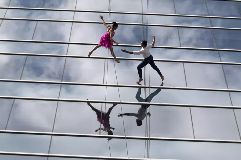 Image: The new Imax film America's Musical Journey includes a scene of Bandaloop dancers at the Hall Arts building in the Dallas Arts District.