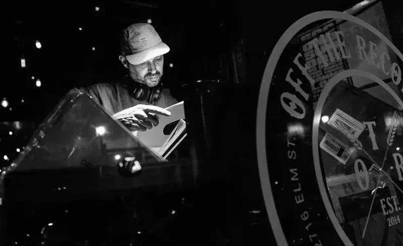 Image: JT Donaldson spins records at his weekly event at Off the Record, New Math Mondays.