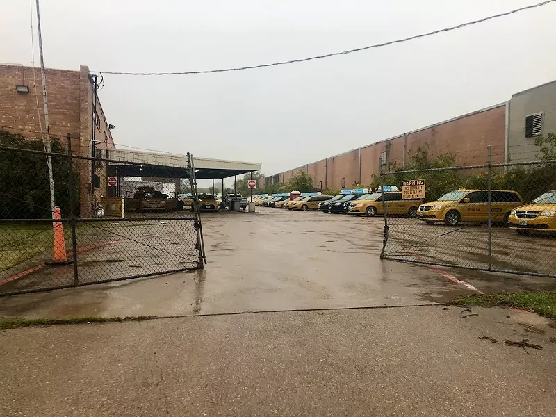 Image: Yellow cabs parked behind Irving Holdings headquarters in Dallas.
