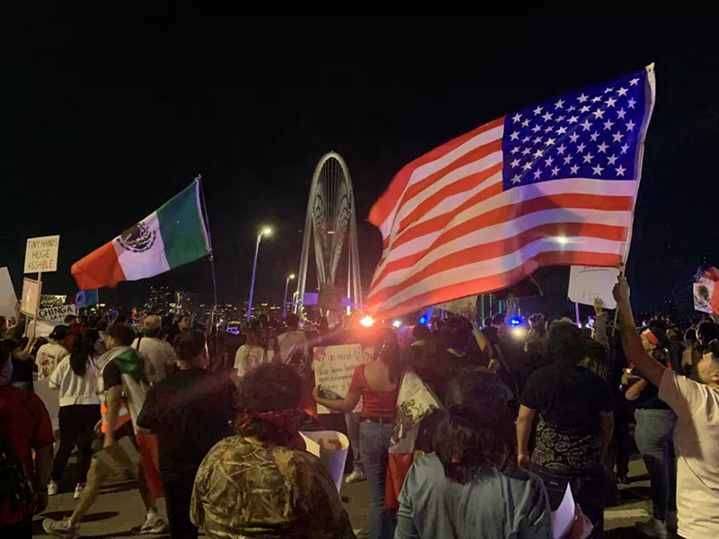 Image: Protesters were blocked from walking onto the Margaret Hunt Hill bridge by police.