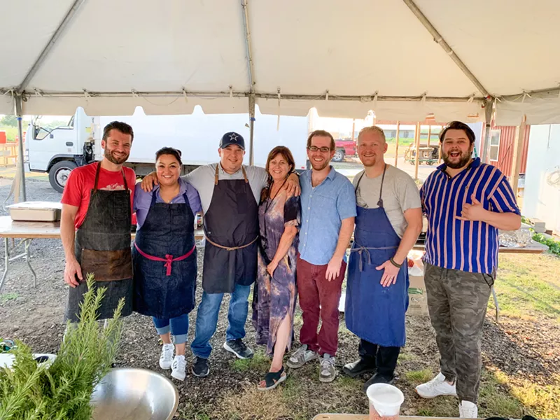 Image: Alex Astranti (far left) at last year's Okrapalooza with fellow El Centro alumni Daniel Pittman (third from left) and Adam West (second from right)
