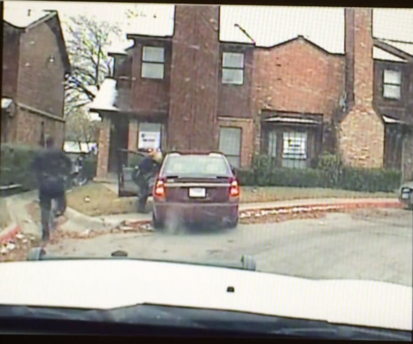 A screen grab from dash-camera footage shows Senior Cpl. Amy Wilburn run up to a car, unholster her weapon and shoot Kelvion Walker once in the stomach. He was unarmed and still had on his seat belt.