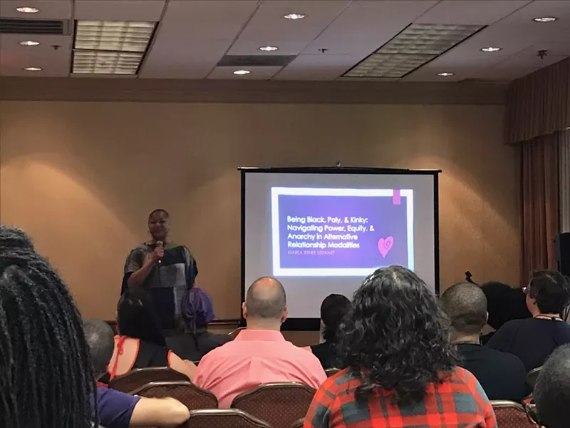 Image: Marla Stewart speaks to attendees about polyamorous relationships during PolyDallas Millennium.