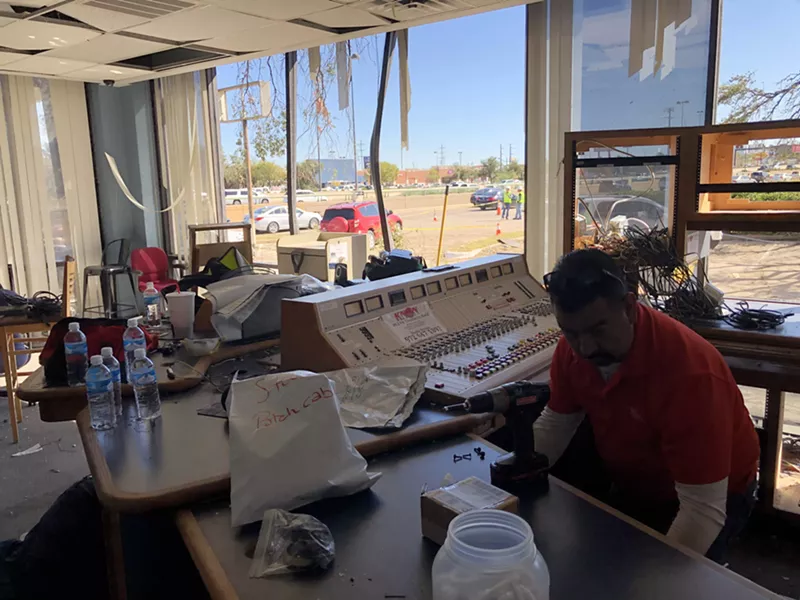 Image: Members of the KNON 89.3 FM crew dismantle the radio station's equipment after a tornado badly damaged the building on North Central Expressway on Sunday night.