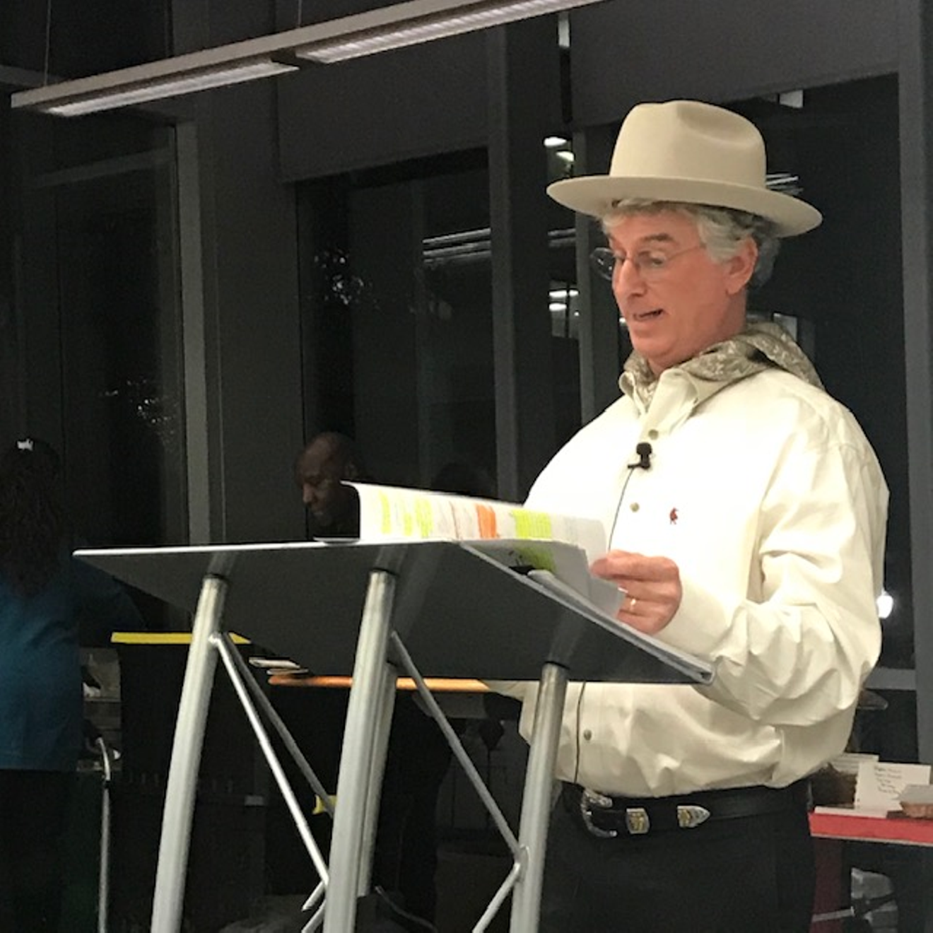 Dave Lieber reads his play at a recent Christmas party.