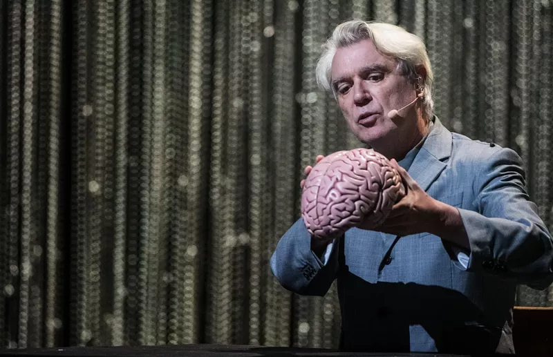 Image: David Byrne singing to a brain.