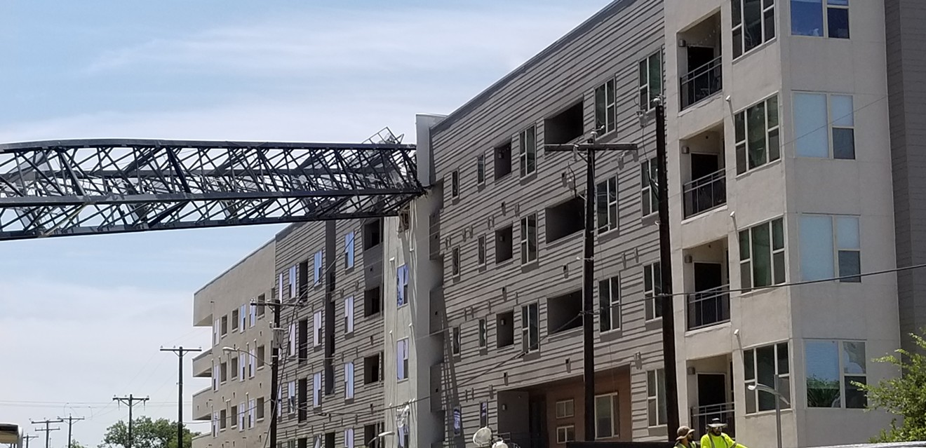 A crane crashed into the Elan City Lights apartment complex Sunday afternoon. The apartment's management company determined the building is "totally unusable for residential purposes."