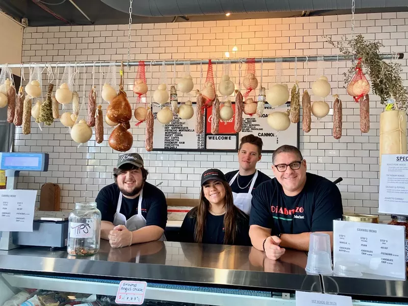 Image: Owner Jack Santarelli (far right) makes sure all his employees understand the details in the recipes and foods that are served.
