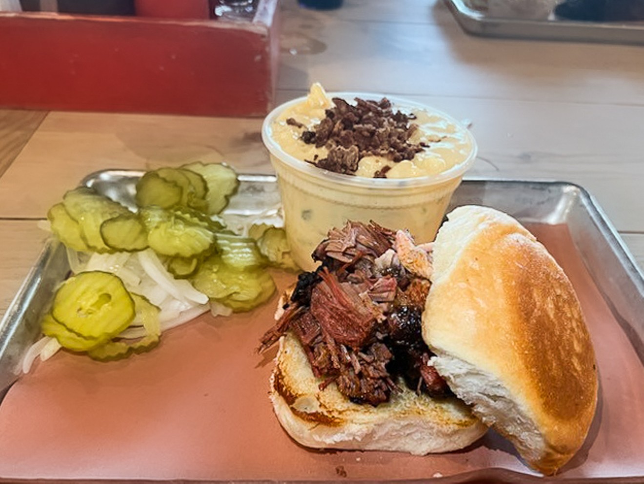 Brisket sandwich with mac and cheese at Pecan Lodge.