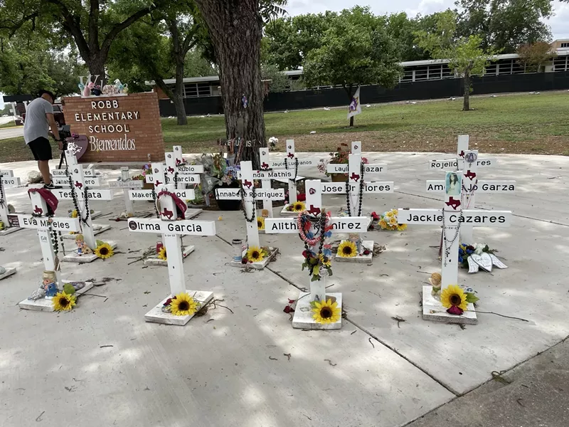 Image: In Uvalde, 21 crosses memorialize those lost last year in the mass shooting at Robb Elementary School.