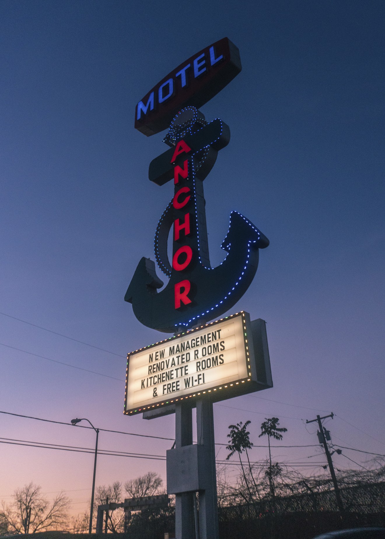 The lighted sign at the Anchor Motel