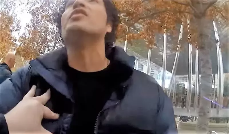 Image: Alan Romero, whose 2-year-old son Luca was just mauled by a pit bull at Klyde Warren Park, is shoved out of the way and threatened with arrest by a Dallas police officer who feels that the pit bull has done no wrong.