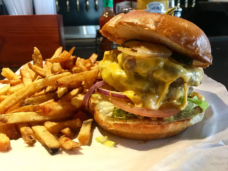 Image: The golden glow of American cheese on the Club Schmitz burger ($10 at lunchtime).