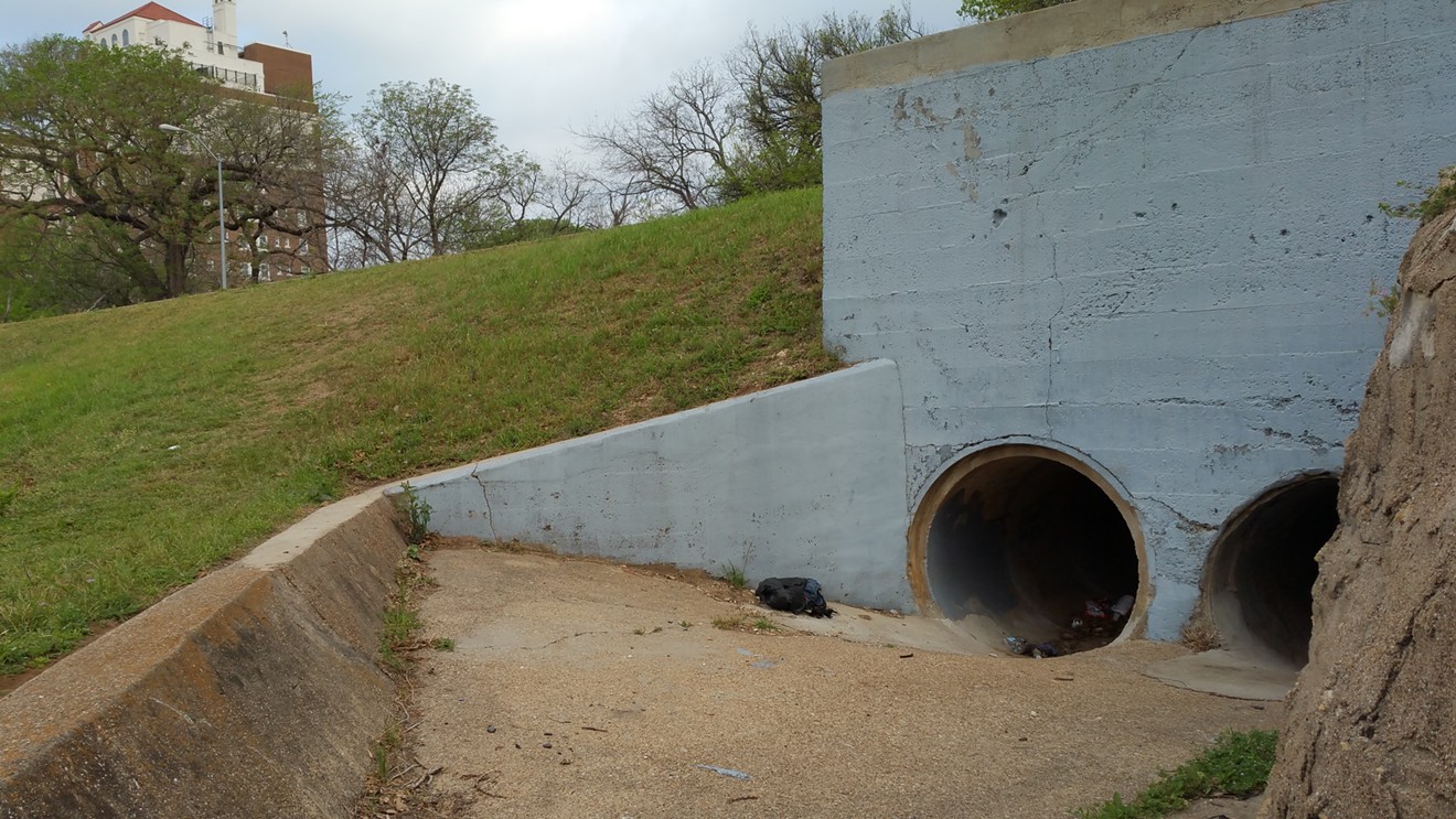 A man died at this drainage tunnel in Lake Cliff Park this month. Just as tragic, the man lived here, one of several hiding underfoot in the park.