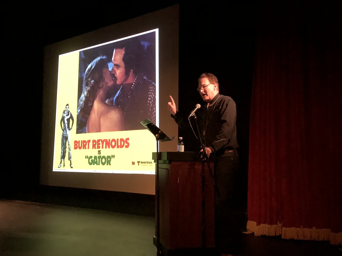Drive-in movie critic Joe Bob Briggs takes an audience in Boston through the history of the redneck in film.