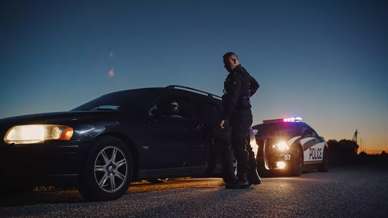 Image: police officer pulling driver over
