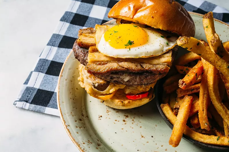 Image: The new summer menu at Grayson Social includes the Grayson Burger, with pork belly, pickled peppers, onion rings, a farm egg and "fry sauce" for $18.