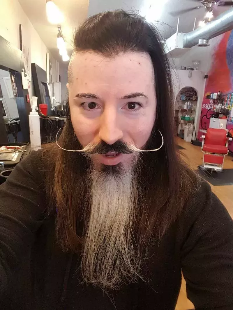 Image: Ale Bonilla, owner of Esoterica Studios in Bishop Arts District, sports his dude blowout.