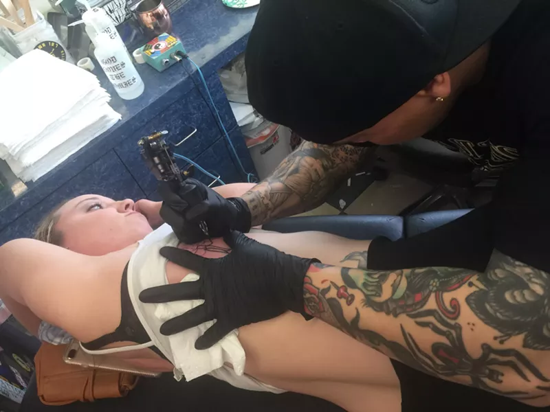 Image: Heather Treadway of Denton gets her fifth Friday the 13th tattoo from artist Bryan Black at Elm Street Tattoo in Deep Ellum.