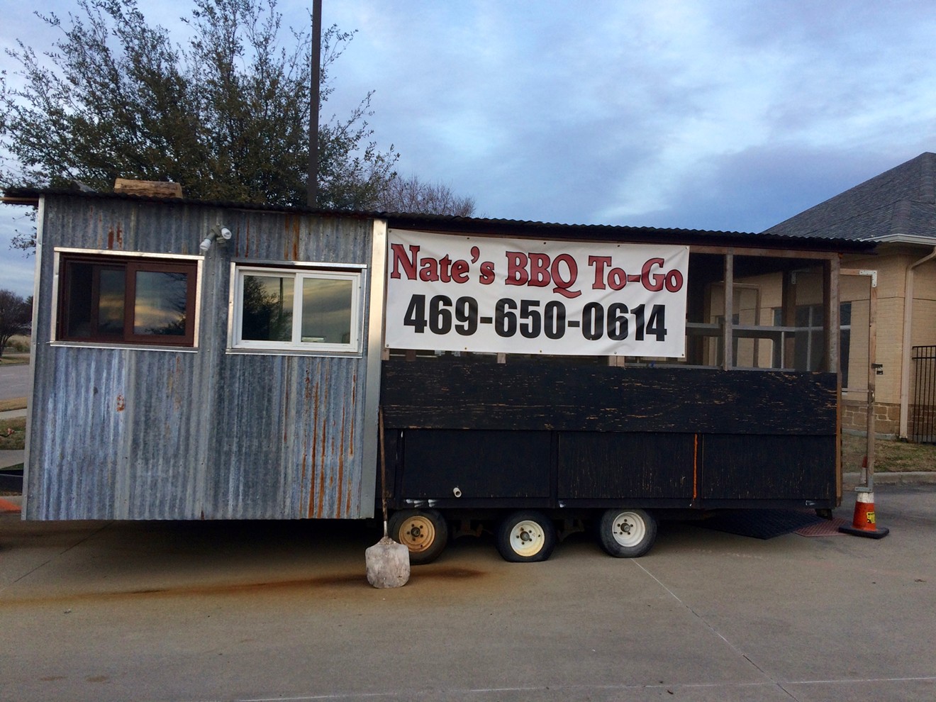 If you happen to see this sign on a trailer while traveling through Carrollton, stop in immediately; killer barbecue awaits.