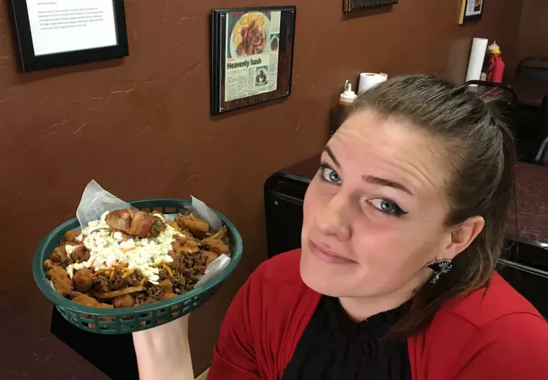 Image: Jambo's co-owner Ashton Stauffer serves up a Hot Mess, the original customer-created menu item, which wasn't necessarily named after her.