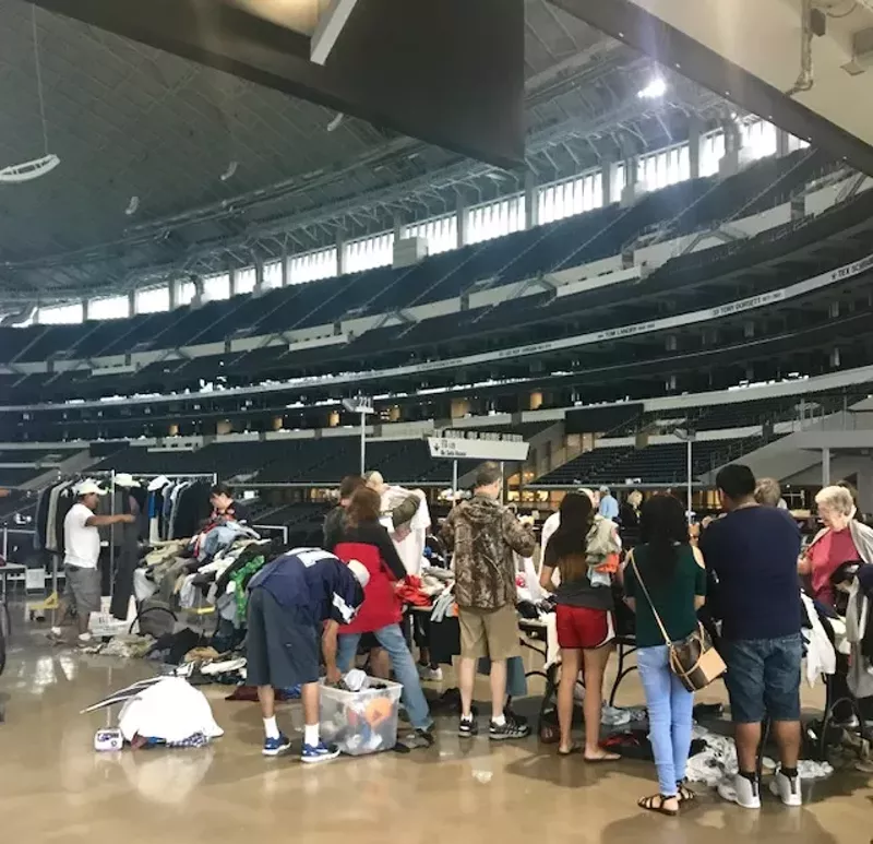 Image: Shoppers line up to pay for their garage sale finds at AT&T Stadium.