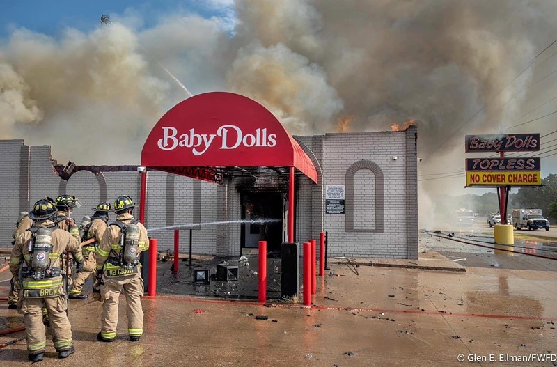 Fire engulfs  the Baby Dolls adult entertainment club in Fort Worth on Wednesday.