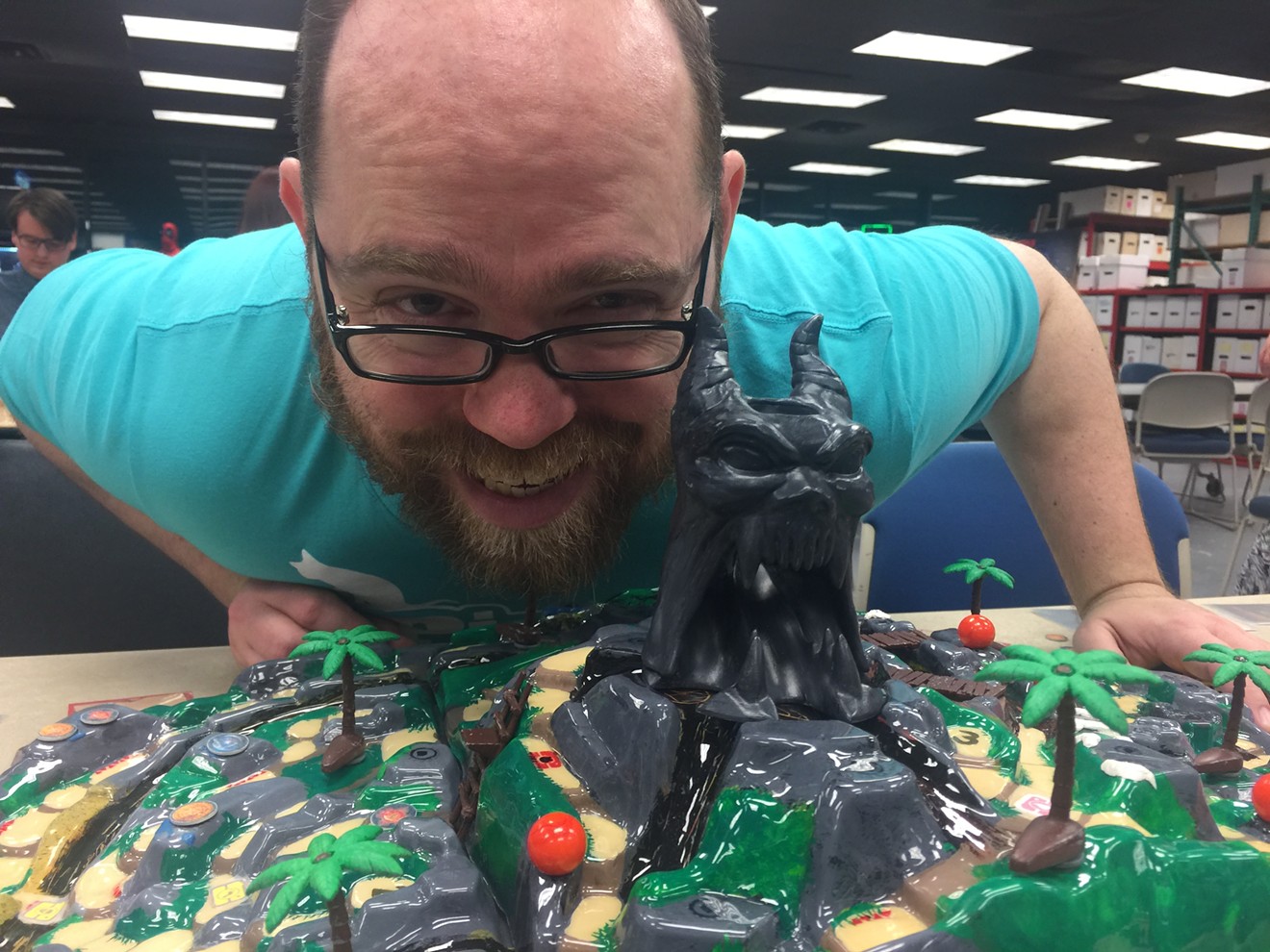 Restoration Games' J.R. Honeycutt, the co-designer of Fireball Island: The Curse of Vul-Kar, shows off the expensive prototype for his epic board game on Thursday night at Collected Comics & Games in Fort Worth at the end of a long, nationwide tour.