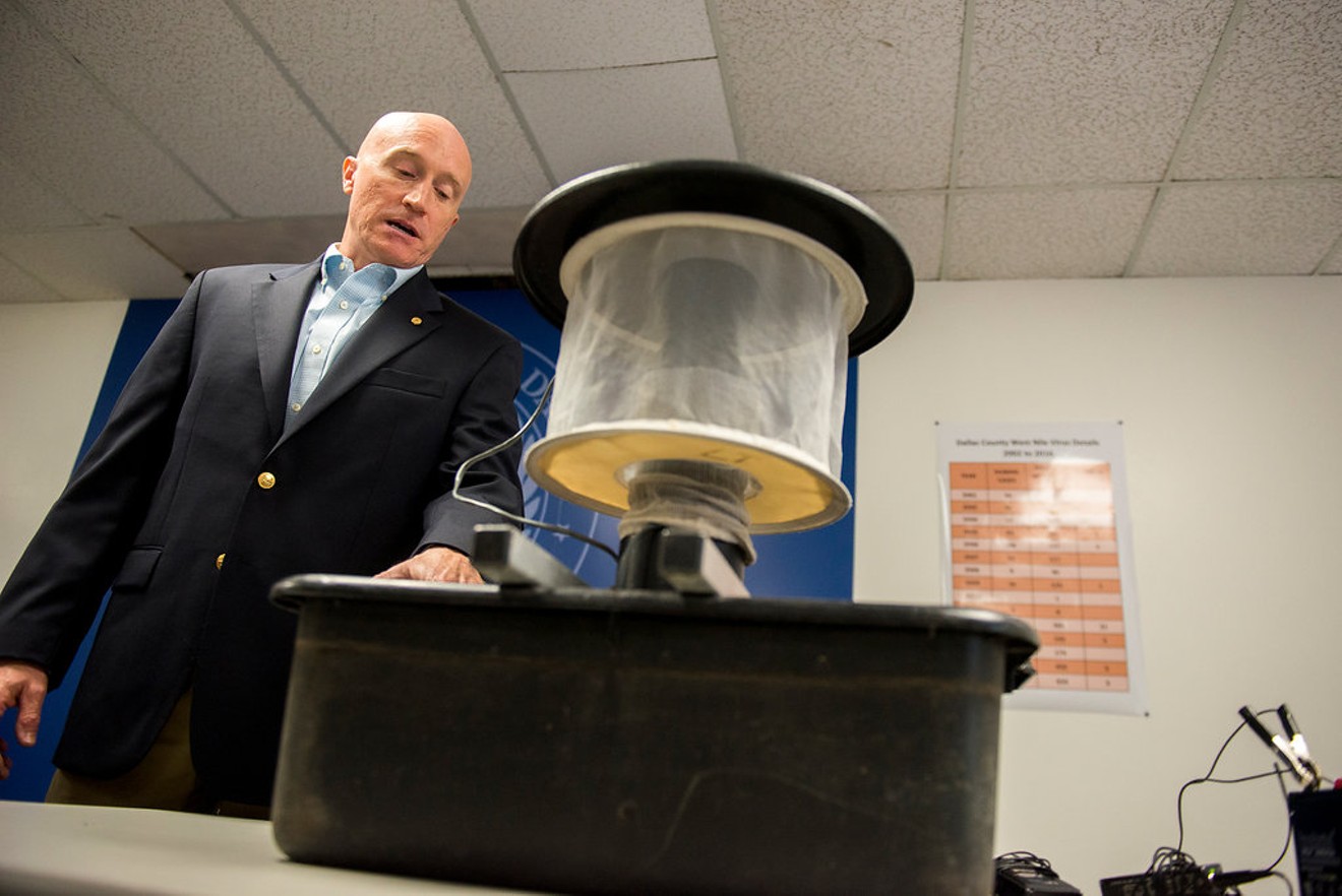 Scott Sawlis of Dallas County Health and Human Services demonstrates a mosquito trap.