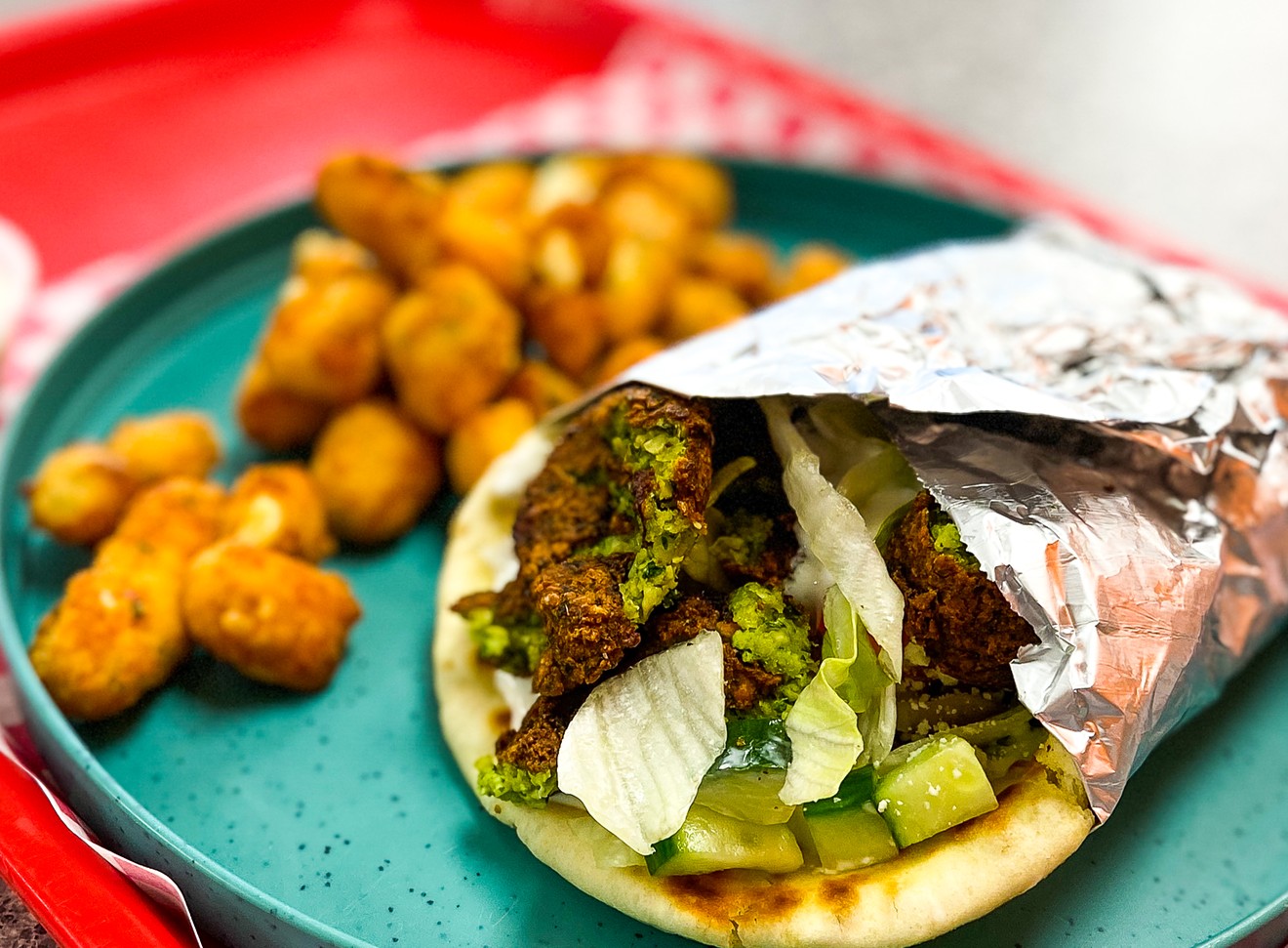 Falafel sandwich and fried garlic cheese curds provide great value and taste at Gyro Hot in Far North Dallas