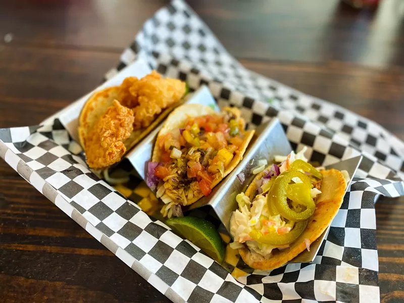 Image: A trio of tacos: shrimp, jerk chicken and BBQ Hennessy pulled pork.